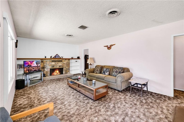7599 Joshua Ln, Yucca Valley, CA 92284 - carpeted living area with a textured ceiling and a stone fireplace