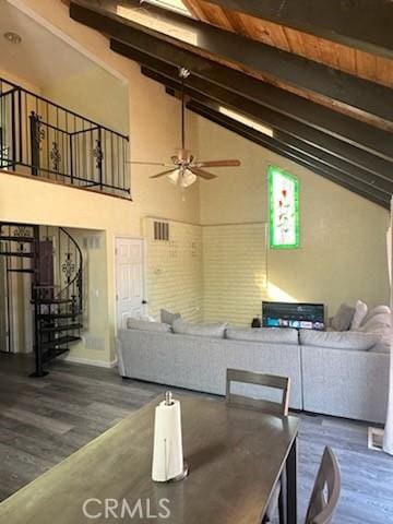 2554 Merced St, Snelling, CA 95369 - living area with wood finished floors, beam ceiling, a ceiling fan, high vaulted ceiling, and stairway