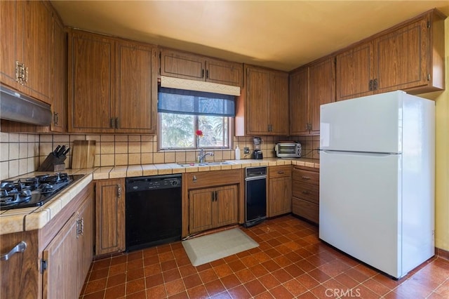 3784 Newton St, Torrance, CA 90505 - kitchen featuring black appliances, a sink, tile countertops, backsplash, and brown cabinets