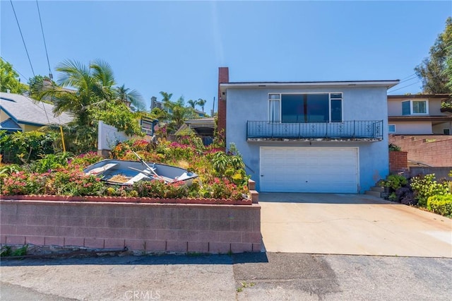 3784 Newton St, Torrance, CA 90505 - view of front facade with stucco siding, an attached garage, and driveway