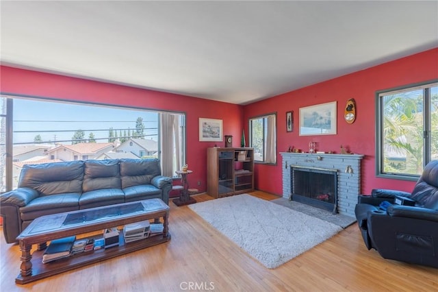 3784 Newton St, Torrance, CA 90505 - living room with plenty of natural light, light wood-style flooring, and a fireplace