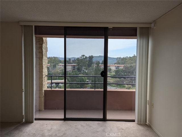 24055 Paseo Del Lago Unit 963, Laguna Woods, CA 92637 - interior space featuring carpet, a mountain view, and a textured ceiling