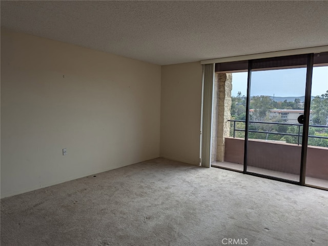 24055 Paseo Del Lago Unit 963, Laguna Woods, CA 92637 - empty room with carpet flooring and a textured ceiling