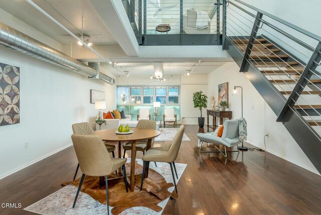 510 S Hewitt St Unit 106, Los Angeles, CA 90013 - dining room with stairway and wood finished floors