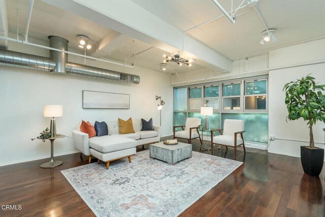 510 S Hewitt St Unit 106, Los Angeles, CA 90013 - living room featuring wood finished floors, a chandelier, and beamed ceiling