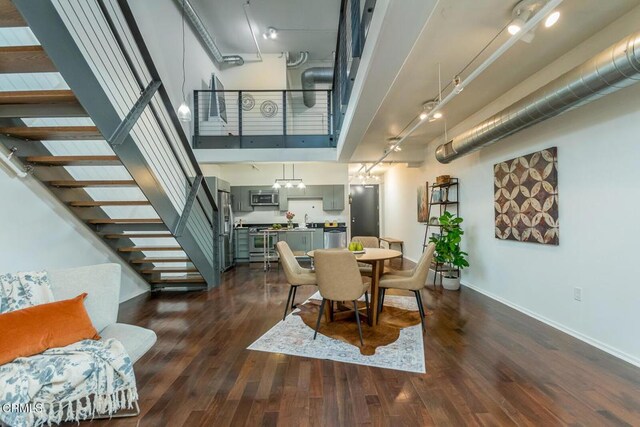 510 S Hewitt St Unit 106, Los Angeles, CA 90013 - dining area featuring dark wood-style floors and stairs