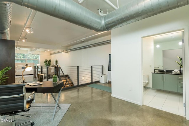 510 S Hewitt St Unit 106, Los Angeles, CA 90013 - home office with a sink and rail lighting