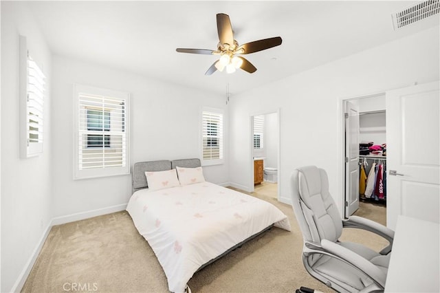 114 Yuba, Irvine, CA 92620 - bedroom featuring light carpet, a walk in closet, baseboards, a closet, and ensuite bath