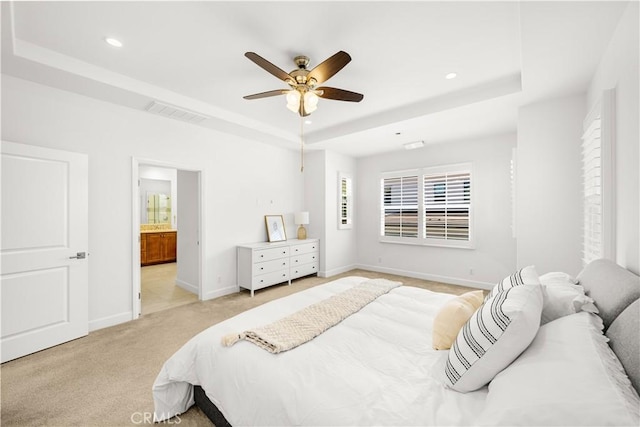 114 Yuba, Irvine, CA 92620 - bedroom featuring a tray ceiling, recessed lighting, baseboards, light colored carpet, and ensuite bathroom