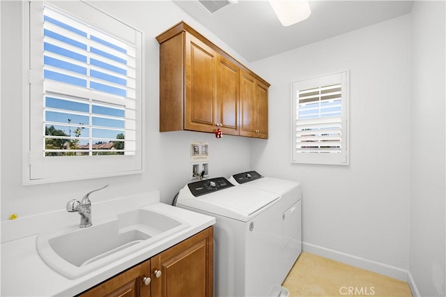 114 Yuba, Irvine, CA 92620 - laundry area featuring washing machine and dryer, cabinet space, healthy amount of natural light, and baseboards