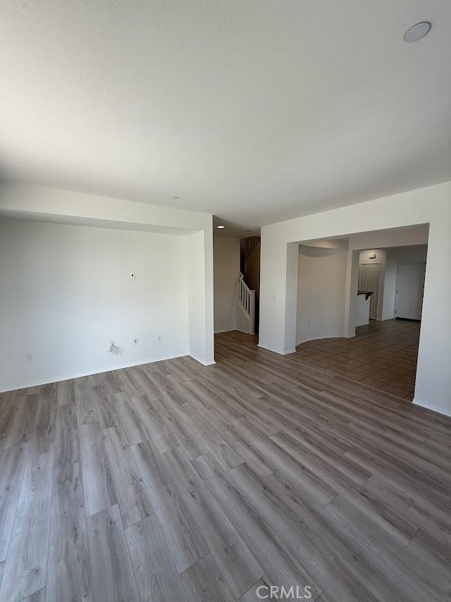 16722 Nicklaus Dr Unit 47, Rancho Cascades, CA 91342 - unfurnished living room featuring wood finished floors