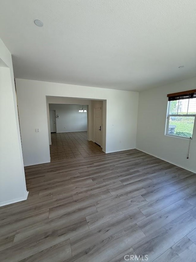 16722 Nicklaus Dr Unit 47, Rancho Cascades, CA 91342 - spare room with baseboards and wood finished floors