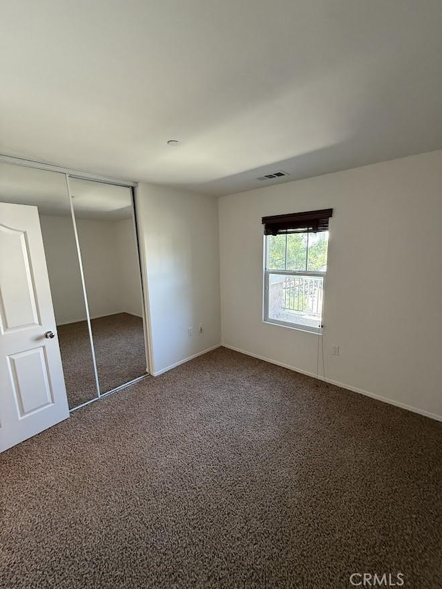 16722 Nicklaus Dr Unit 47, Rancho Cascades, CA 91342 - unfurnished bedroom with carpet, a closet, and baseboards