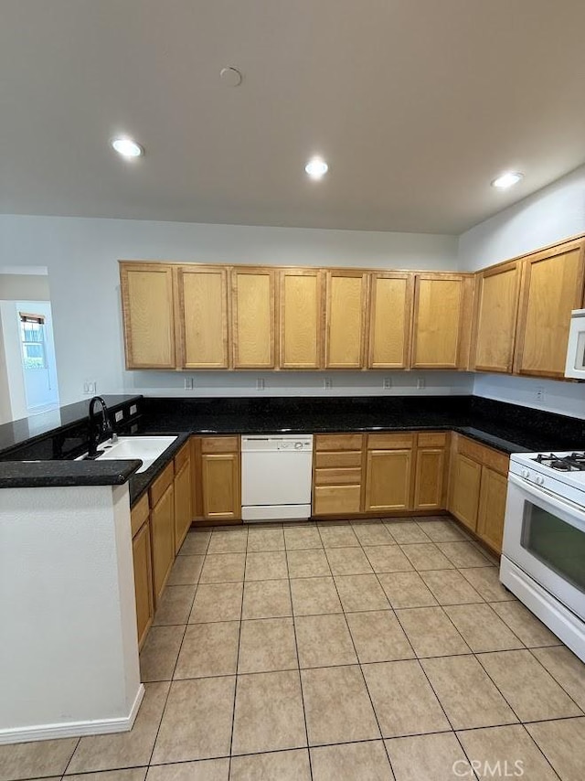 16722 Nicklaus Dr Unit 47, Rancho Cascades, CA 91342 - kitchen with white appliances, a sink, recessed lighting, light tile patterned flooring, and a peninsula