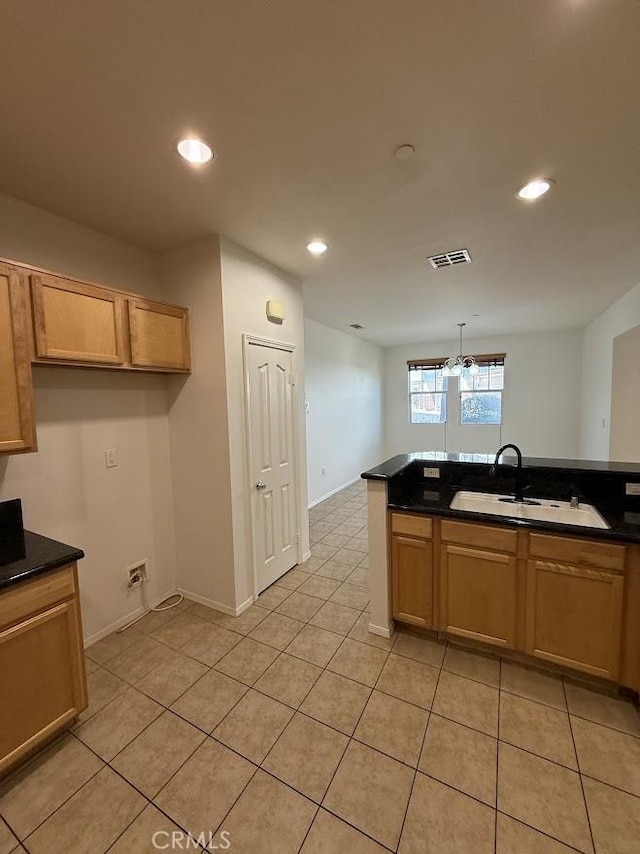16722 Nicklaus Dr Unit 47, Rancho Cascades, CA 91342 - kitchen with a sink, dark countertops, light tile patterned floors, recessed lighting, and baseboards