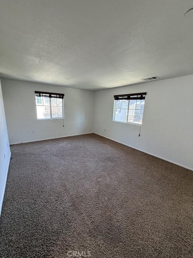 16722 Nicklaus Dr Unit 47, Rancho Cascades, CA 91342 - carpeted empty room featuring baseboards and a textured ceiling