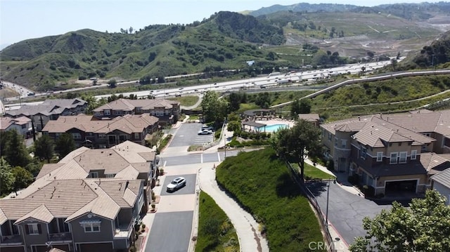 16722 Nicklaus Dr Unit 47, Rancho Cascades, CA 91342 - aerial view of property's location with a mountainous background and nearby suburban area