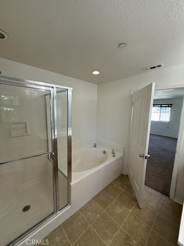 16722 Nicklaus Dr Unit 47, Rancho Cascades, CA 91342 - bathroom with a shower stall, a garden tub, a textured ceiling, tile patterned floors, and recessed lighting