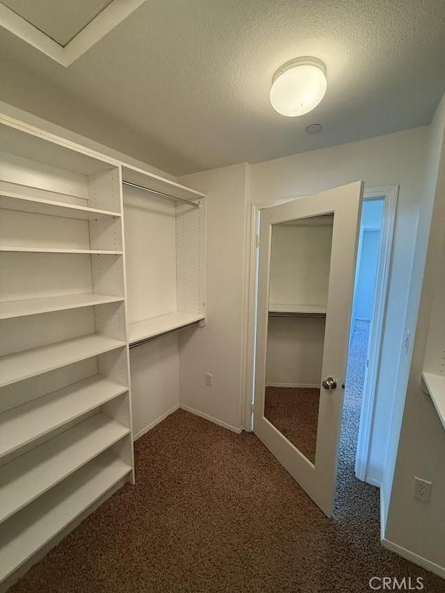 16722 Nicklaus Dr Unit 47, Rancho Cascades, CA 91342 - spacious closet featuring dark colored carpet