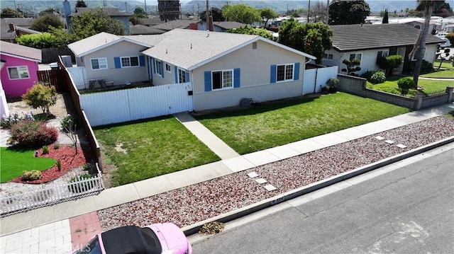 view of front of property featuring a residential view, a gate, and stucco siding