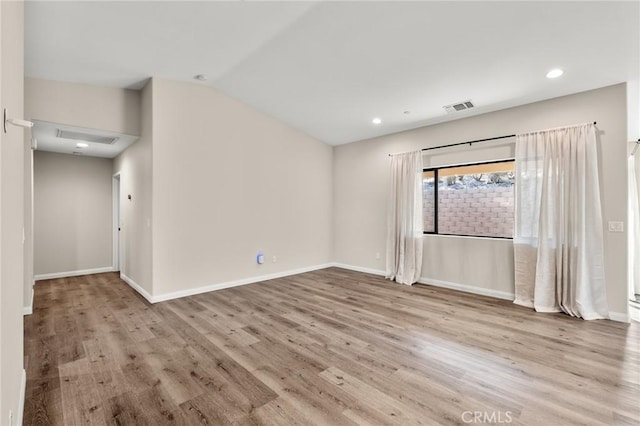 8244 Balsa Ave, Yucca Valley, CA 92284 - empty room featuring wood finished floors, baseboards, recessed lighting, and lofted ceiling