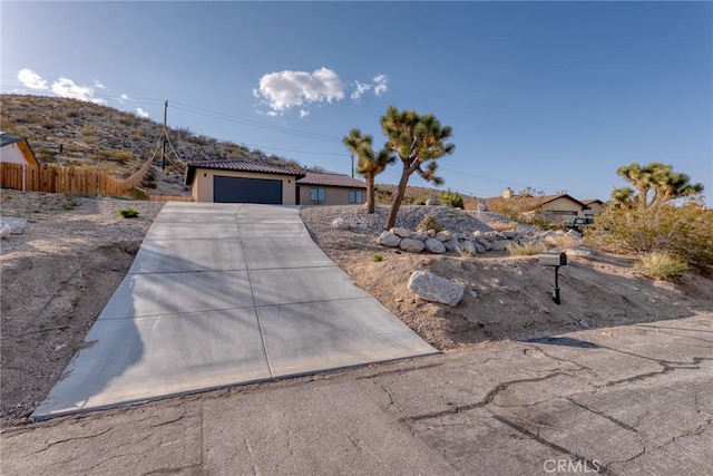 8244 Balsa Ave, Yucca Valley, CA 92284 - ranch-style home featuring a garage and driveway