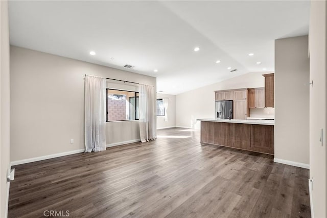 8244 Balsa Ave, Yucca Valley, CA 92284 - unfurnished living room with vaulted ceiling, dark wood-style flooring, recessed lighting, and baseboards