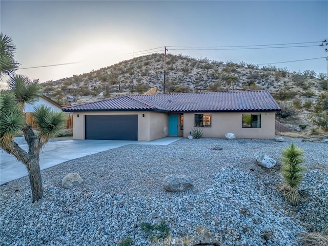 8244 Balsa Ave, Yucca Valley, CA 92284 - single story home featuring a garage, driveway, stucco siding, and a tile roof