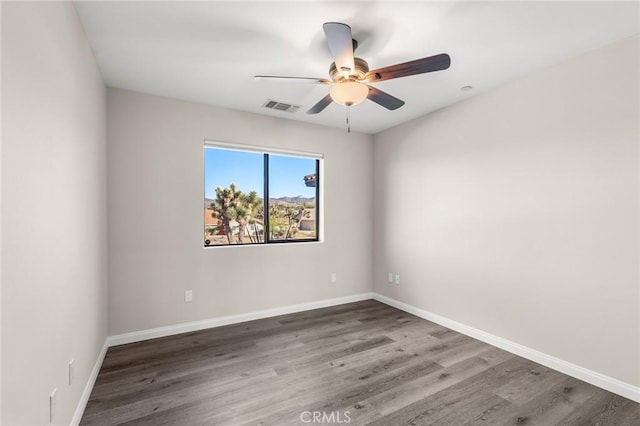 8244 Balsa Ave, Yucca Valley, CA 92284 - spare room with a ceiling fan and wood finished floors