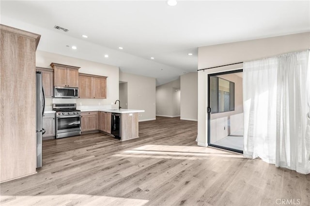 8244 Balsa Ave, Yucca Valley, CA 92284 - kitchen featuring stainless steel appliances, open floor plan, light wood-style floors, recessed lighting, and lofted ceiling