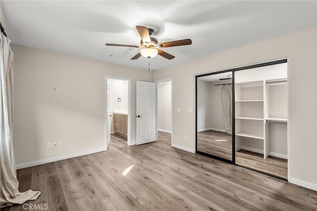 8244 Balsa Ave, Yucca Valley, CA 92284 - unfurnished bedroom with light wood finished floors, baseboards, a closet, and ceiling fan