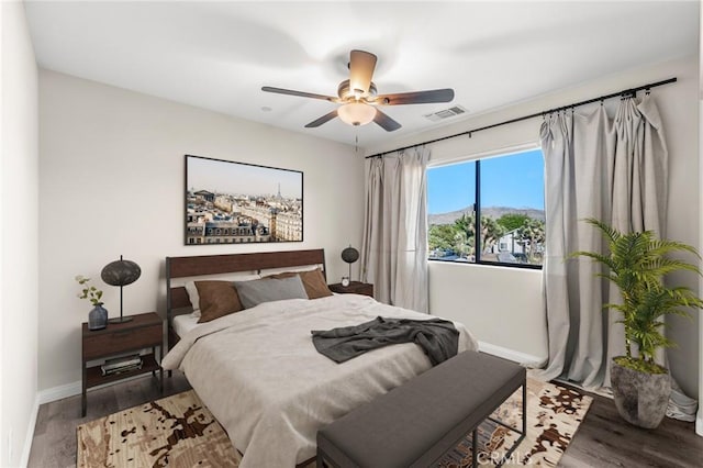 8244 Balsa Ave, Yucca Valley, CA 92284 - bedroom featuring wood finished floors and a ceiling fan