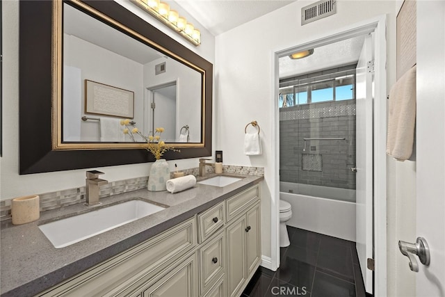 356 Freedom, Upland, CA 91786 - bathroom featuring toilet, double vanity, tub / shower combination, and tile patterned flooring