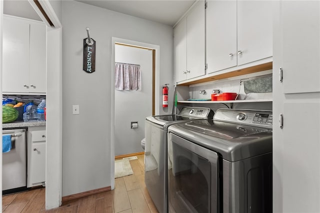 5203 Desert View Dr, Wrightwood, CA 92397 - laundry room with separate washer and dryer, cabinet space, light wood-style floors, and baseboards