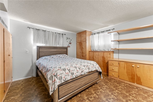 5203 Desert View Dr, Wrightwood, CA 92397 - bedroom with a textured ceiling, parquet floors, and baseboards