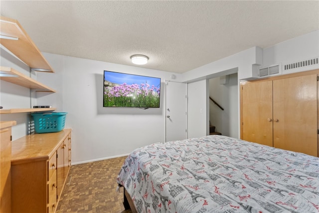 5203 Desert View Dr, Wrightwood, CA 92397 - bedroom with a textured ceiling and baseboards