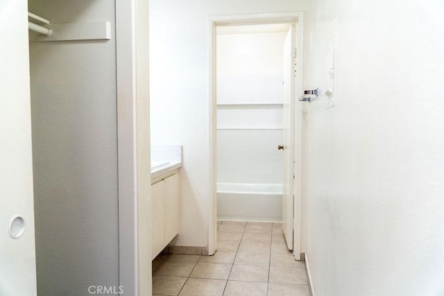 8990 19th St Unit 268, Rancho Cucamonga, CA 91701 - bathroom with tile patterned flooring, vanity, and a tub to relax in