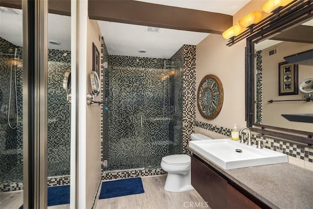 81 Cloudcrest, Aliso Viejo, CA 92656 - full bath featuring wood finished floors, vanity, a stall shower, and decorative backsplash