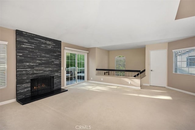 81 Cloudcrest, Aliso Viejo, CA 92656 - unfurnished living room featuring carpet floors, a large fireplace, and plenty of natural light