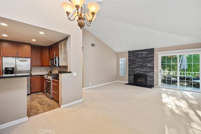 81 Cloudcrest, Aliso Viejo, CA 92656 - kitchen with appliances with stainless steel finishes, light carpet, a chandelier, baseboards, and recessed lighting