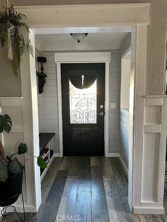 mudroom featuring dark wood-style flooring