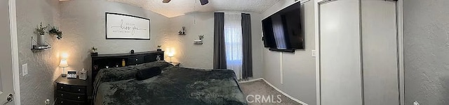 corridor featuring baseboards and carpet