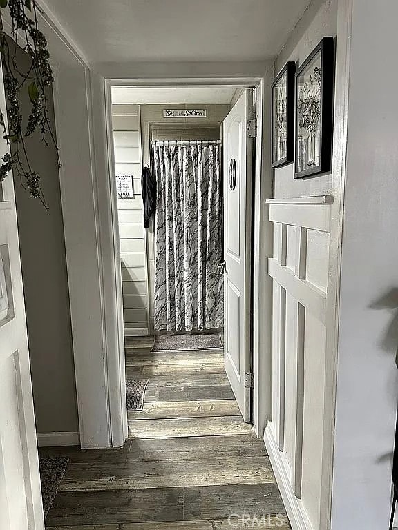 hall with wood finished floors