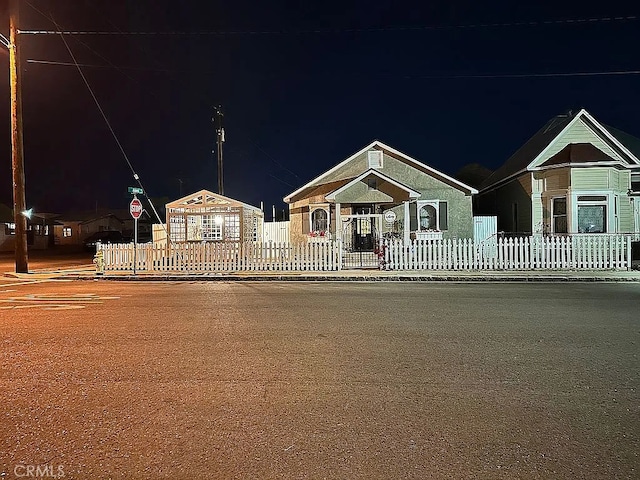 view of front of property with fence