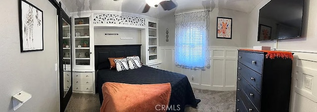 bedroom featuring carpet and vaulted ceiling