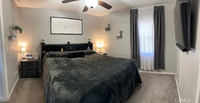 carpeted bedroom with a textured ceiling, a textured wall, baseboards, and a ceiling fan