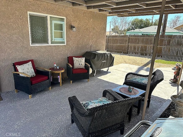 view of patio / terrace featuring fence and grilling area