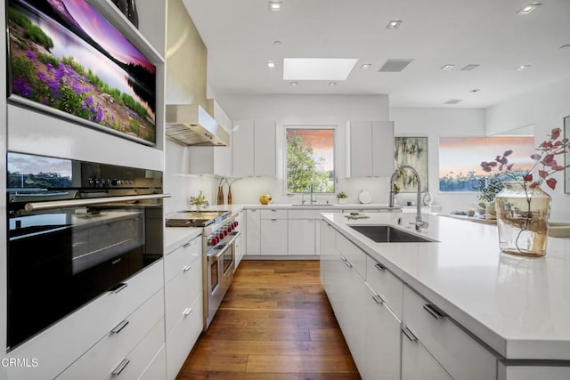 1116 Linda Flora Dr, Los Angeles, CA 90049 - kitchen featuring oven, a sink, double oven range, modern cabinets, and recessed lighting