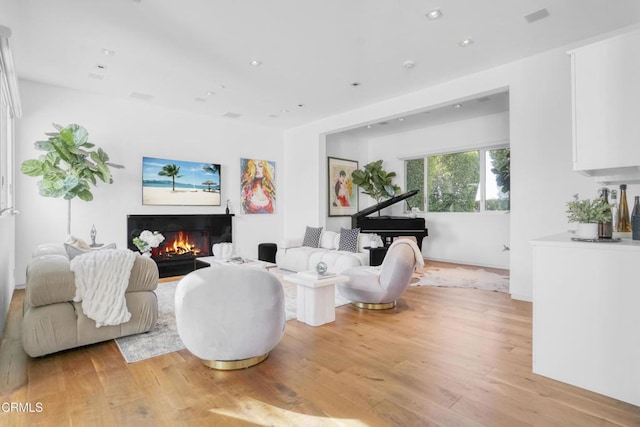 1116 Linda Flora Dr, Los Angeles, CA 90049 - living area with light wood-style floors, a glass covered fireplace, and recessed lighting