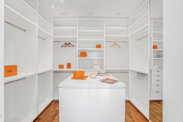 1116 Linda Flora Dr, Los Angeles, CA 90049 - walk in closet with wood finished floors
